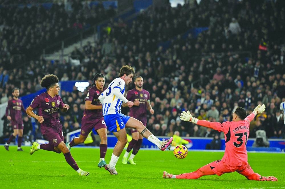 
Brighton’s Matt O’Riley scores the winning goal past Manchester City’s goalkeeper Ederson during the Premier League match. (AFP) 