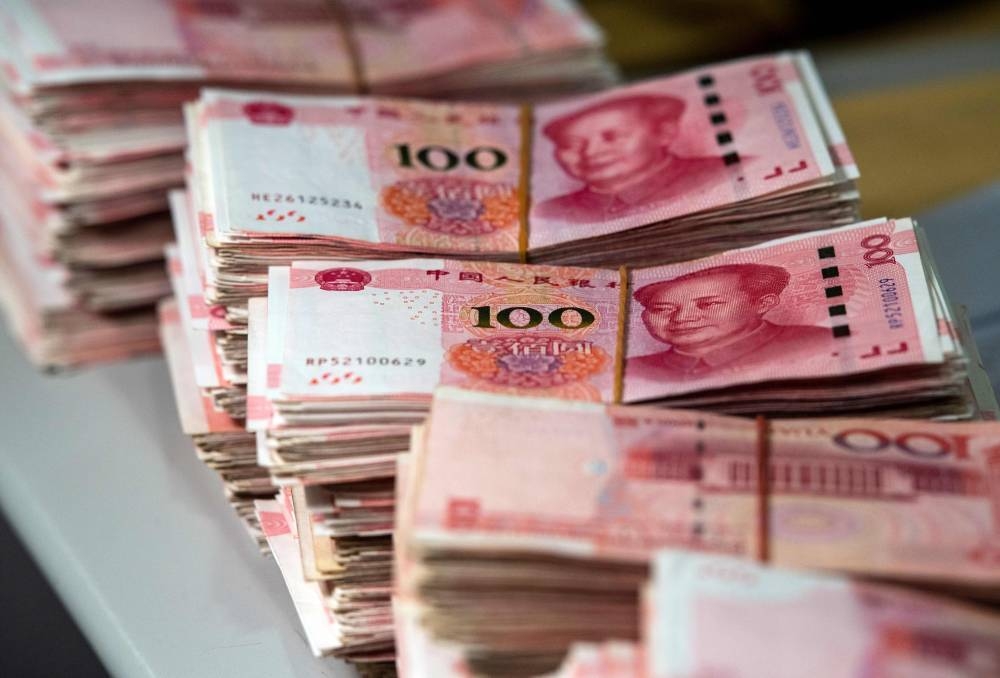 Bundles of 100 yuan notes at a bank in Shanghai. China’s slowing economic activity showed initial signs of stabilisation last month, following a broad package of stimulus introduced from the end of September that included a slew of interest-rate cuts. October is usually a weak month for credit growth because banks aren’t in a rush to hit their quarterly lending targets.