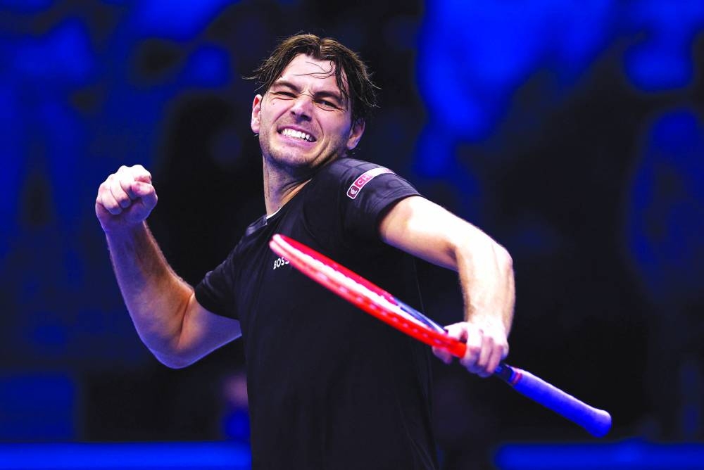 Taylor Fritz of the US celebrates winning his singles group stage match against Australia’s Alex de Minaur at the ATP Finals in Inalpi Arena, Turin, Italy, yesterday. (Reuters)