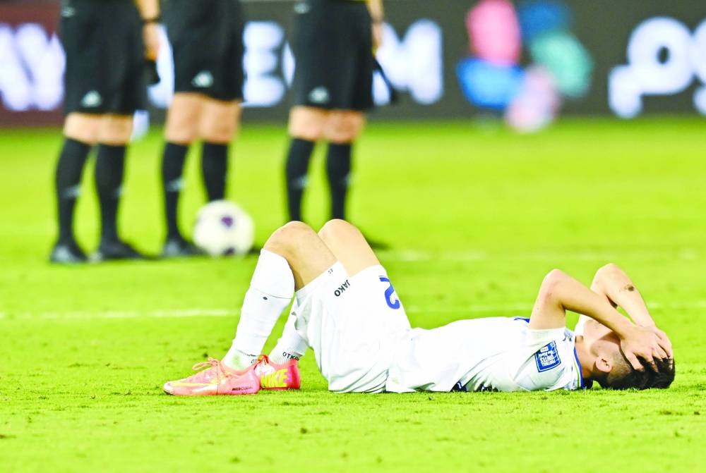 
An Uzbekistan player can’t hide his disappointment after heart-breaking defeat to Qatar at the Jassim Bin Hamad Stadium. 