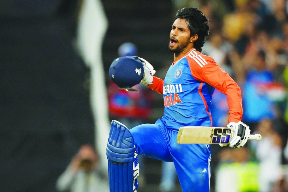 India's Tilak Varma celebrates after scoring a century during the fourth T20I against South Africa at Wanderers stadium in Johannesburg yesterday. (AFP)