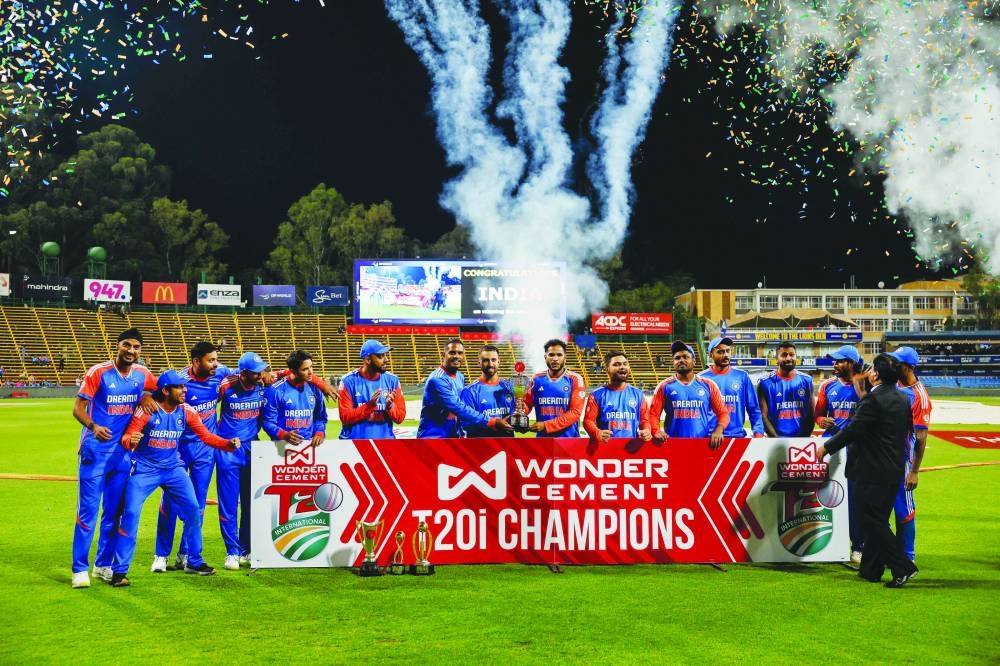 
India players celebrate with the trophy after winning the T20 series against South Africa in Johannesburg yesterday. (AFP) 