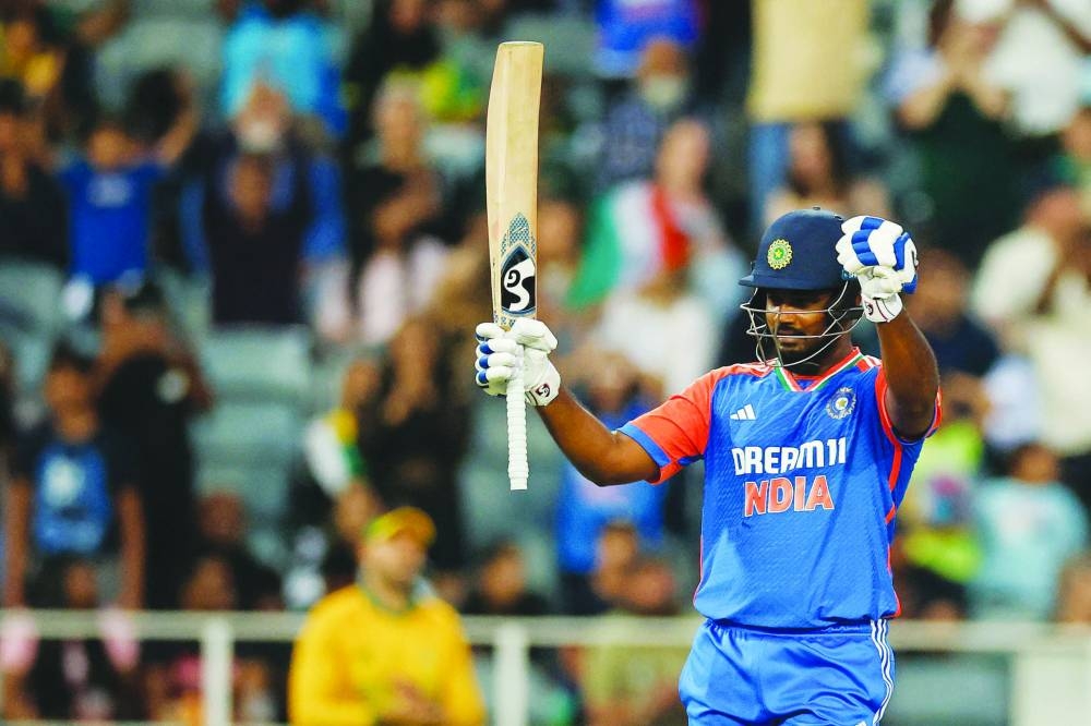 
India’s Tilak Varma (left) and Sanju Samson celebrate after scoring their centuries in Johannesburg yesterday. 