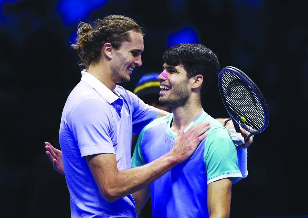 
Germany’s Alexander Zverev (left) and Spain’s Carlos Alcaraz embrace after their ATP Finals match in Tuirn.  