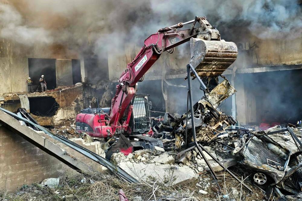 Rescuers search for survivors at the site of an Israeli airstrike that targeted the southern Lebanese city of Nabatieh, on Saturday. AFP