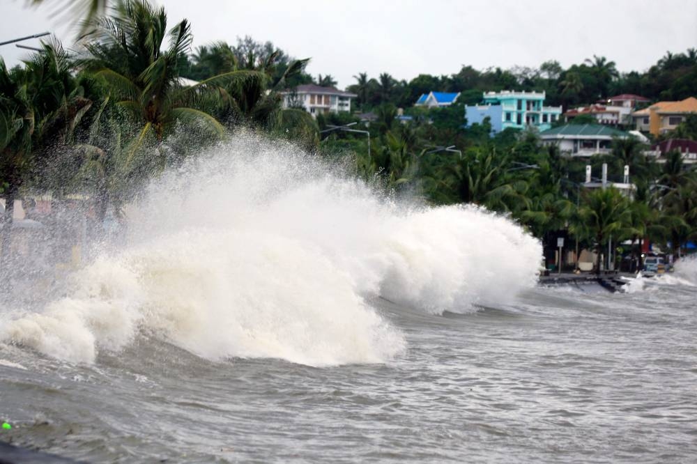 Large waves break along a seawall ahead of the expected landfall of Super Typhoon Man-yi, in Legaspi City, Albay province on Saturday. AFP