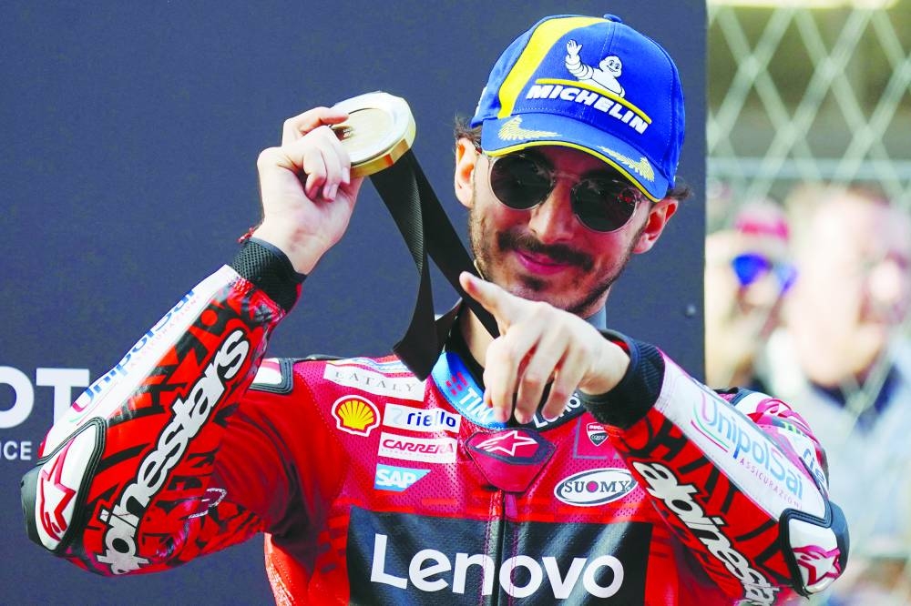 Ducati Italian rider Francesco Bagnaia celebrates getting the pole position after winning the MotoGP sprint race of the Solidarity Grand Prix of Barcelona at the Circuit de Catalunya in Montmelo yesterday. (AFP) 