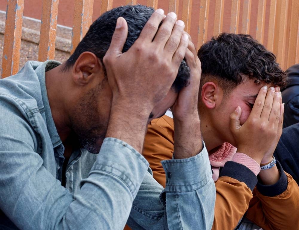 People mourn Palestinians killed in an Israeli strike, at Nasser hospital in Khan Younis in the southern Gaza Strip, on Sunday. REUTERS
