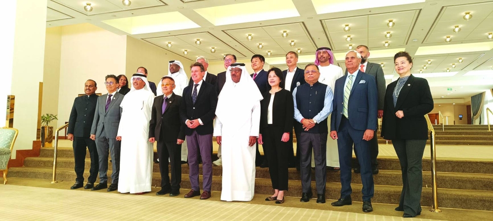Sebastian Coe, President of World Athletics, and Qatar’s Dahlan al-Hamad, President of Asian Athletics Association (AAA), are seen with AAA officials in Doha on Thursday.