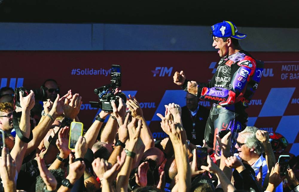 Prima Pramac Racing’s Jorge Martin celebrates with teammates after winning the MotoGP World Championship yesterday. (Reuters)