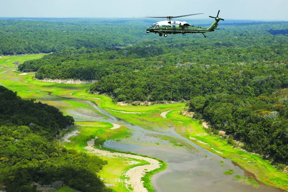 Marine One flies Biden on an aerial tour of the Amazon in Manaus. Reuters