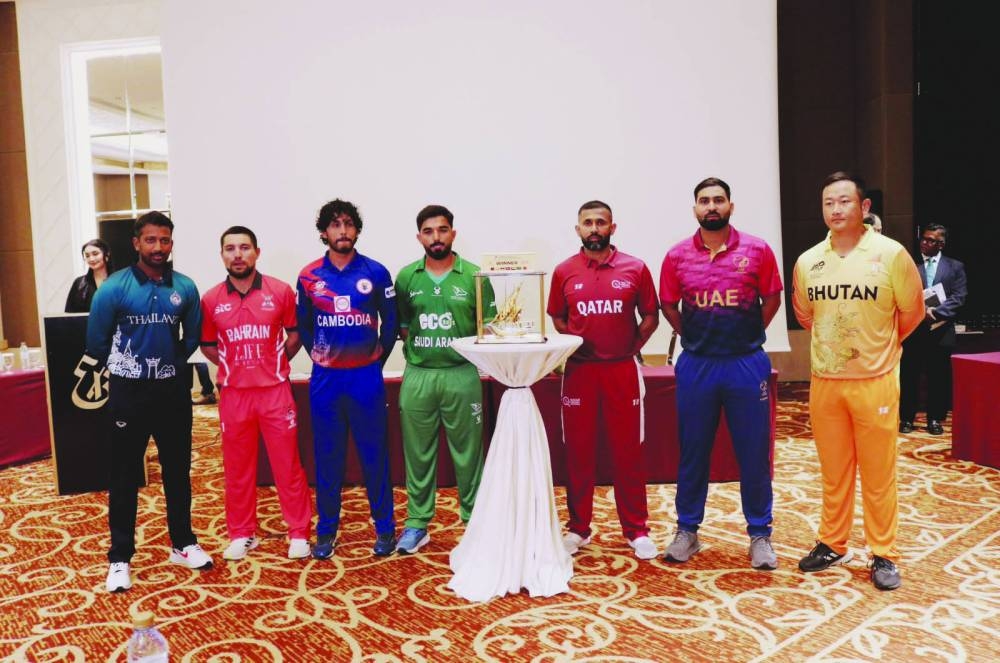 Captains of Qatar, Saudi Arabia, Bhutan, Bahrain, Thailand, the UAE and Cambodia pose with the trophy yesterday.