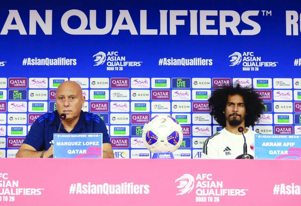 
Qatar coach Marquez Lopez and player Akram Afif address a news conference in Abu Dhabi yesterday.  