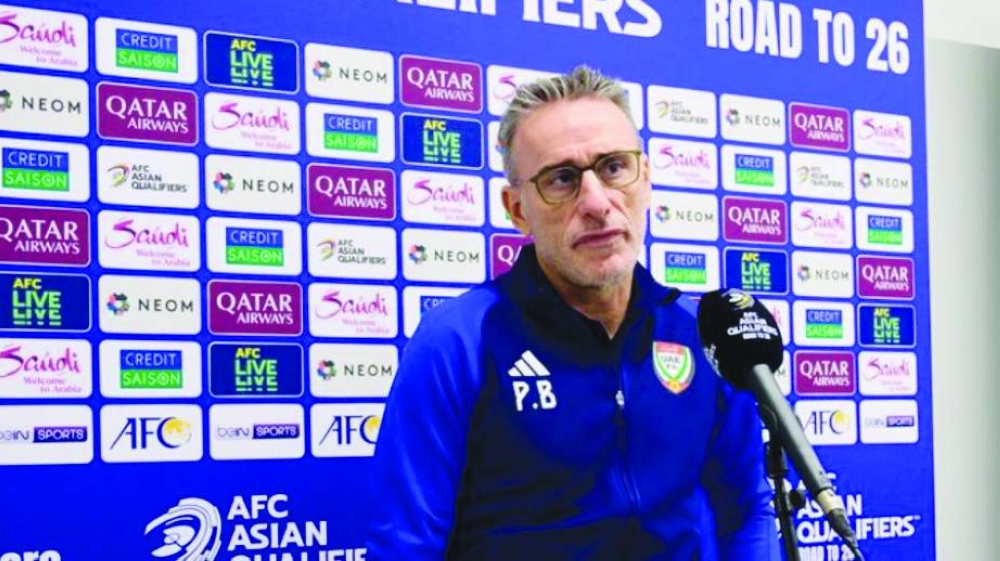 
UAE coach Paulo Bento addressing the media yesterday. Right: UAE players during a training session ahead of their match against Qatar. 
