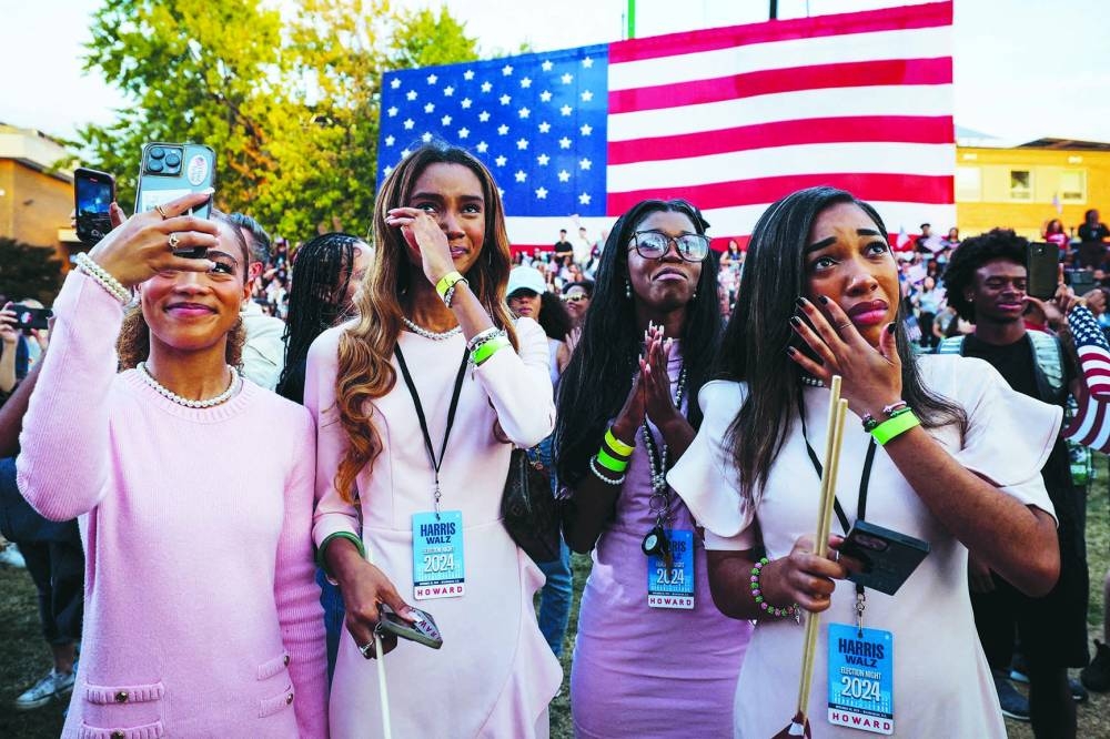Supporters react while another takes a selfie as Democratic presidential nominee US Vice President Kamala Harris delivers remarks, conceding the 2024 US Presidential Election to President-elect Donald Trump, at Howard University in Washington. (Reuters)