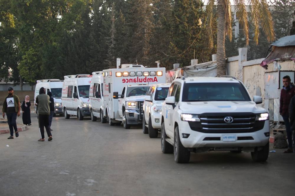 A convoy organised by the World Health Organisation and the Palestinian Red Crescent prepares to start from the European Hospital in Khan Yunis south of Gaza, evacuating some patients and war-wounded from the besieged Palestinian territory on Wednesday. AFP