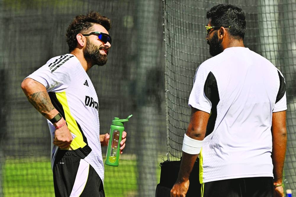 India’s Virat Kohli (left) talks with Jasprit Bumrah during a practice session at the Optus Stadium in Perth on Wednesday, ahead of first Test against Australia. (AFP)