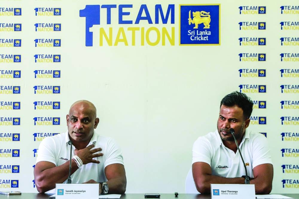 Sri Lanka's head coach Sanath Jayasuriya (left) speaks as chief selector Upul Tharanga looks on during a press conference ahead of the team's departure to South Africa for two Test matches, in Colombo on Thursday. (AFP)