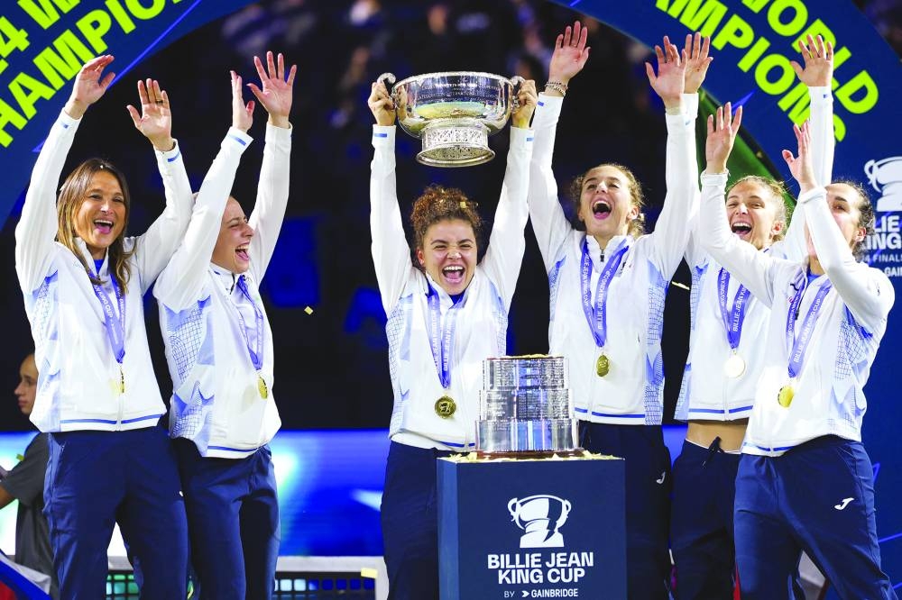 
Italy’s Jasmine Paolini (centre) and Team Italy teammates hold up the trophy after winning the Billie Jean King Cup Finals at the Palacio de Deportes Jose Maria Martin Carpena arena in Malaga, Spain. (AFP) 