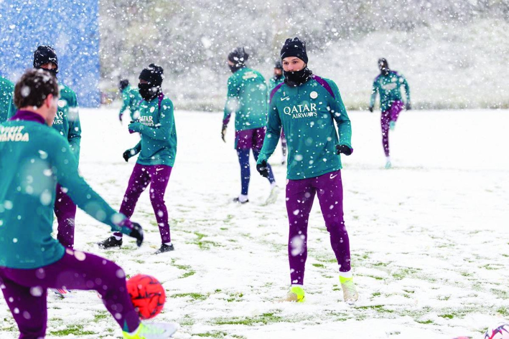 
Paris Saint-Germain players train in the snow yesterday, ahead of their Ligue 1 match against Toulouse. 