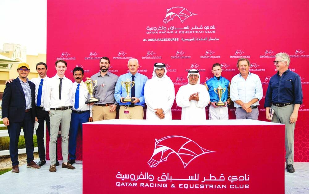 Connections of Dark Trooper celebrate after the four-year-old won the QA Group 3 Barzan Cup at the Al Uqda Racecourse on Thursday. PICTURE: Juhaim