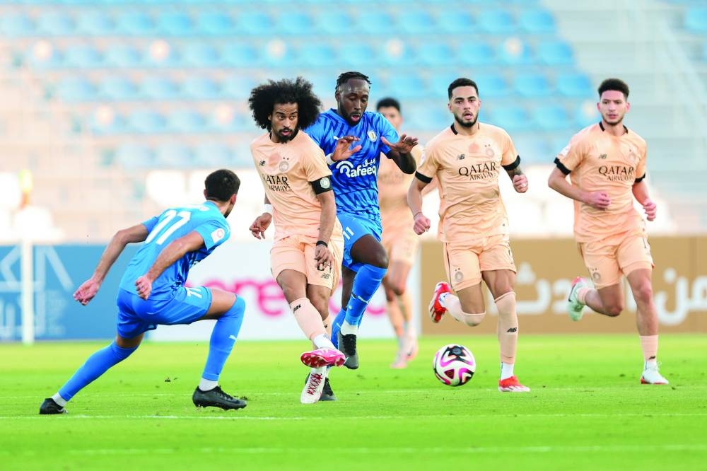 Al Sadd’s Akran Afif (second left) scores against Al Khor in the Qatar Stars League at the Al Khor Stadium on Friday.