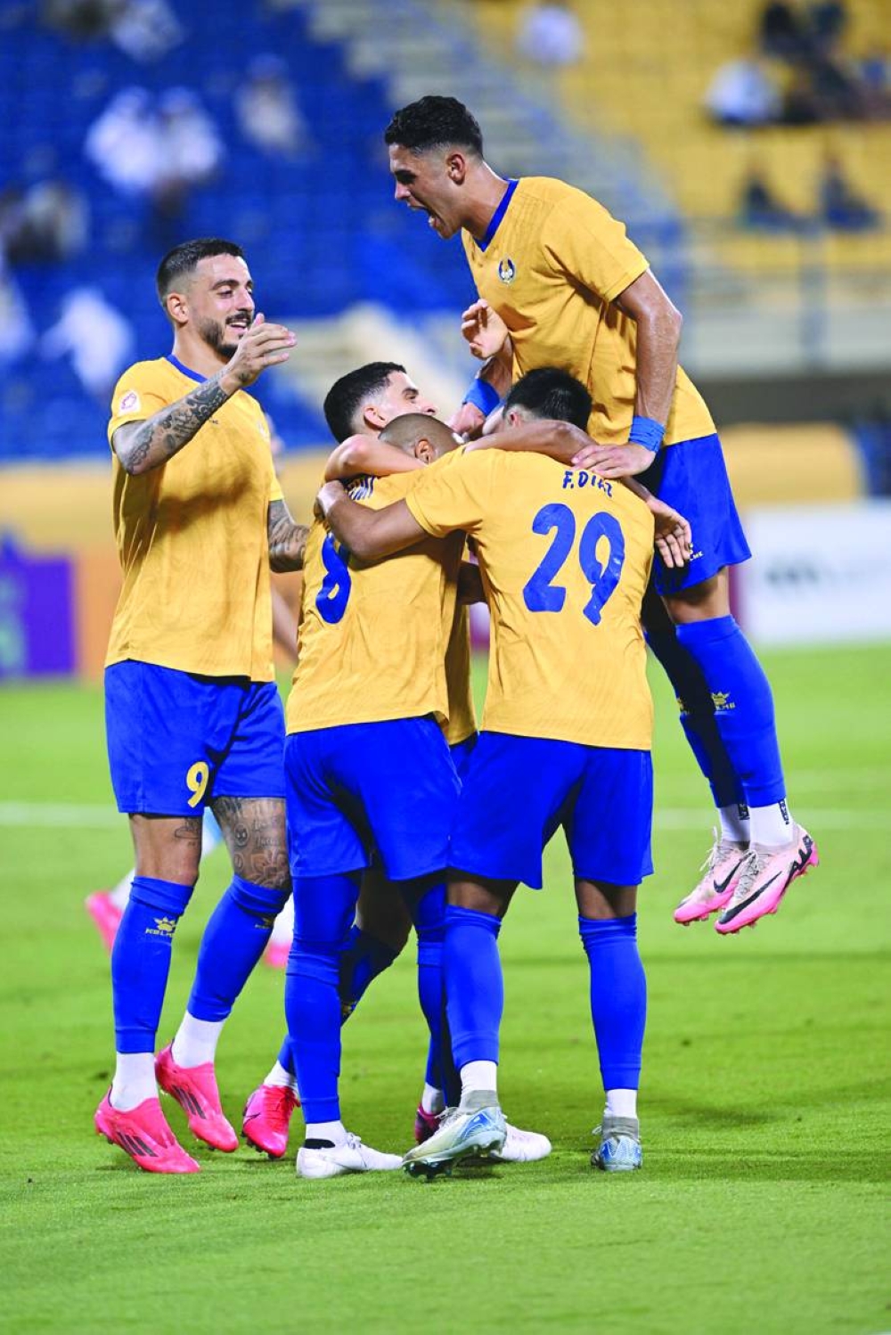 
Al Gharafa players celebrate after their win over Al Wakrah at Thani Bin Jassim Stadium.  