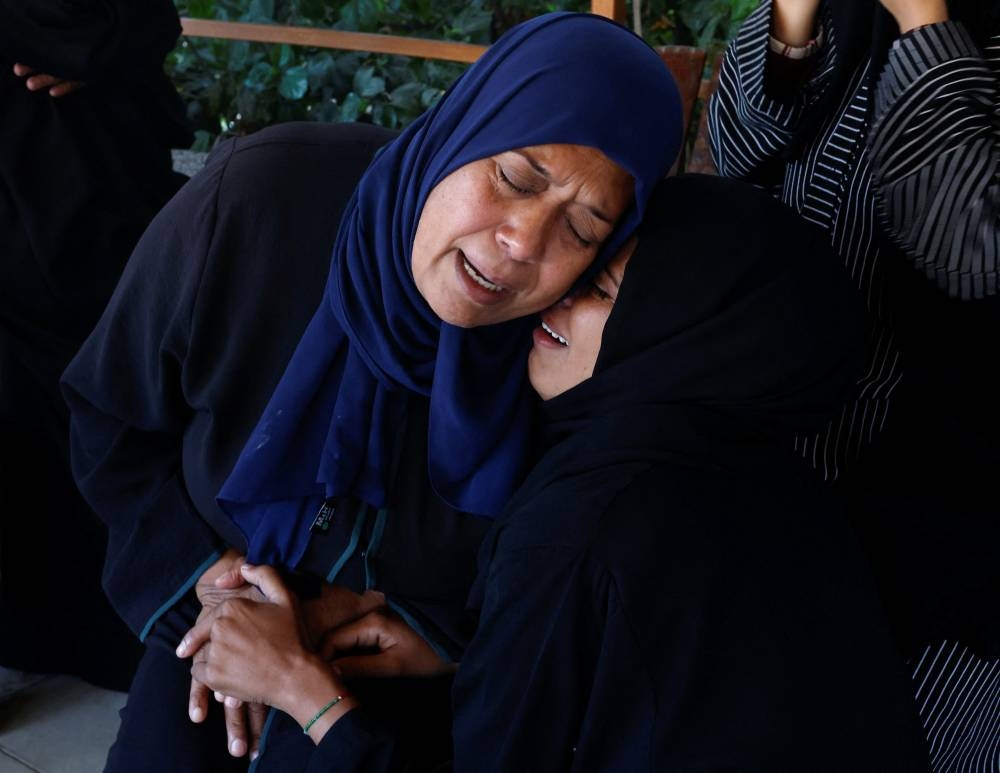 People mourn Palestinians killed in an Israeli strike, at Nasser hospital in Khan Younis in the southern Gaza Strip, on Saturday. REUTERS