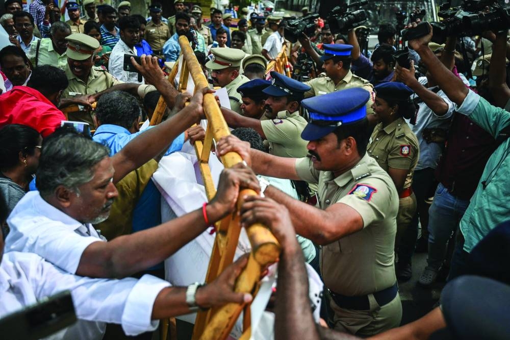 Members of the Communist Party of India (CPI-M) scuffle with police personnel during a protest against India’s Prime Minister Narendra Modi and billionaire businessman Gautam Adani, calling for the tycoon’s arrest over corruption allegations by US prosecutors, in Chennai yesterday.