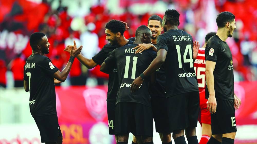 
Al Duhail’s Homam al-Ameen (second left) celebrates with teammates after scoring against Al Arabi at the Al Thumama Stadium. 