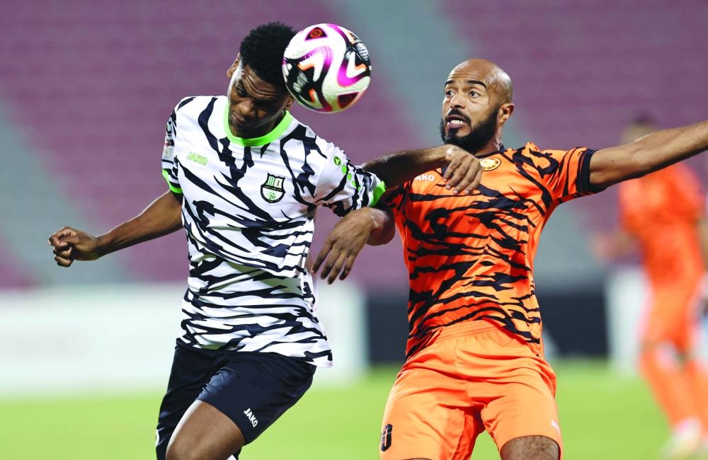 
Umm Salal’s Ali Afif (right) and Al Ahli’s Sekou Yansane vie for the ball in the Qatar Stars League at Grand Hamad Stadium. PICTURE: Noushad Thekkayil
 