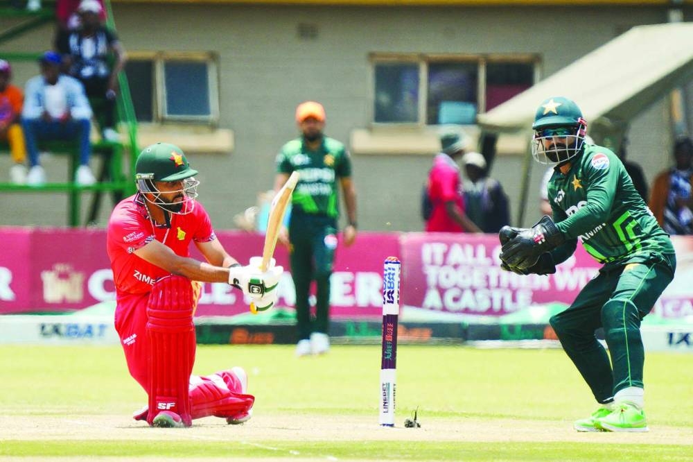 Zimbabwe’s Sikandar Raza (left) plays a sweep during the first ODI against Pakistan at Queens Sports Club in Bulawayo on Sunday. (AFP)