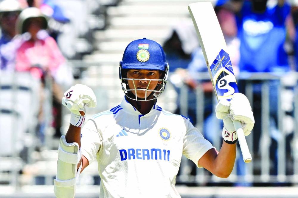 India’s Yashasvi Jaiswal celebrates as he reaches 150 runs on day three of the first Test against Australia in Perth on Sunday. (AFP)