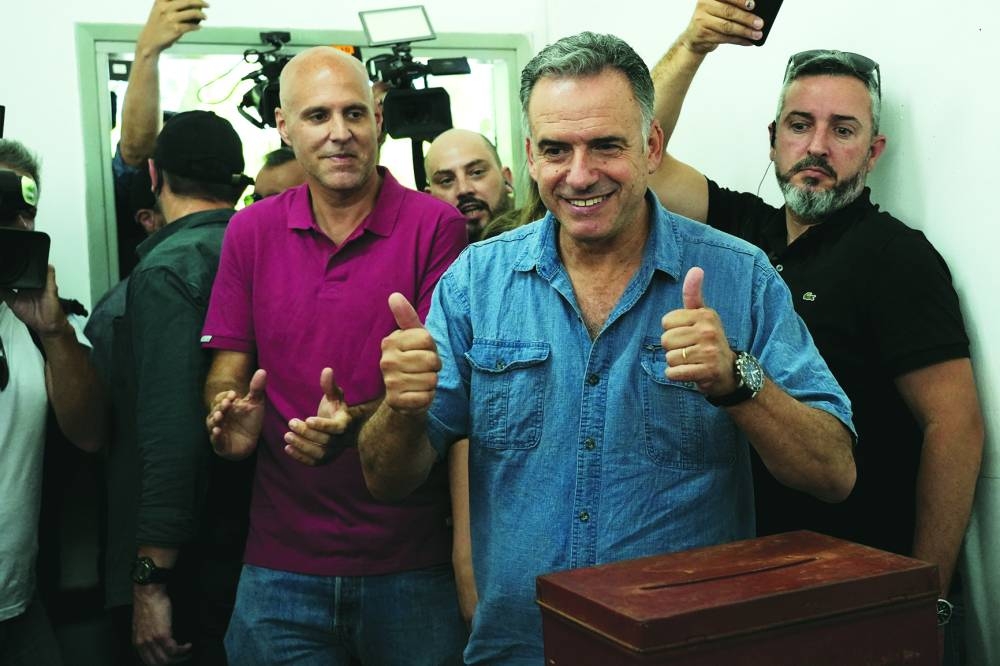 Yamandu Orsi gestures after voting for a presidential election run-off between him and the candidate of the ruling conservative coalition Alvaro Delgado, at a polling station in Canelones. – Reuters