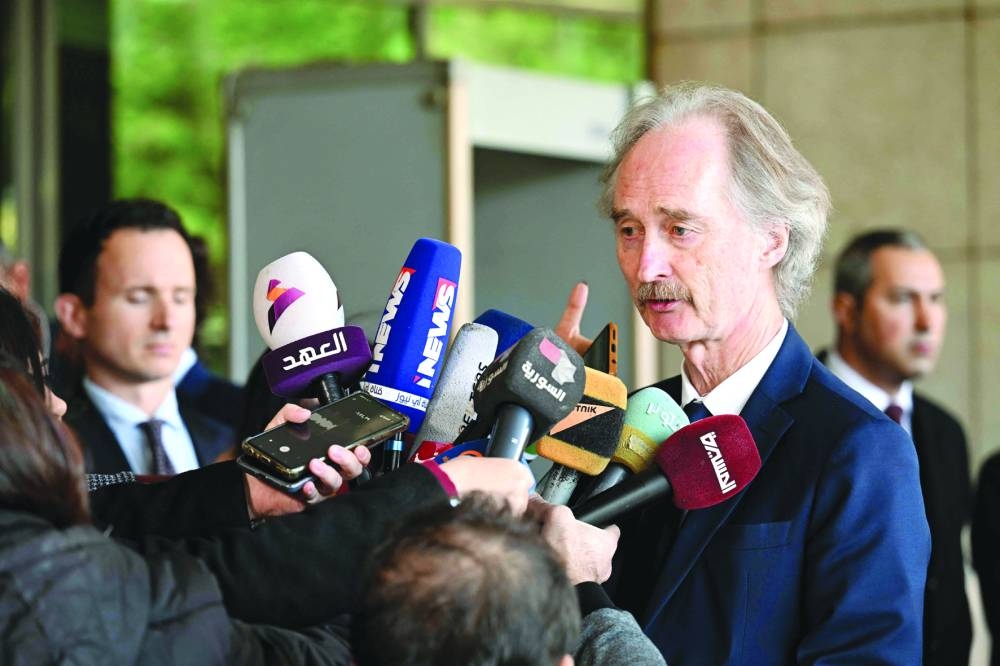 UN Special Envoy for Syria Geir Pedersen speaks to members of the media as he leaves a hotel in Damascus, yesterday.