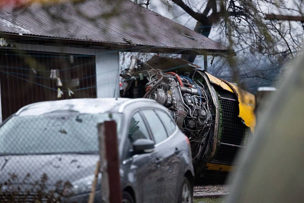 The wreckage of the DHL cargo plane is seen at the crash site near Vilnius International Airport, Lithuania, on Monday. REUTERS