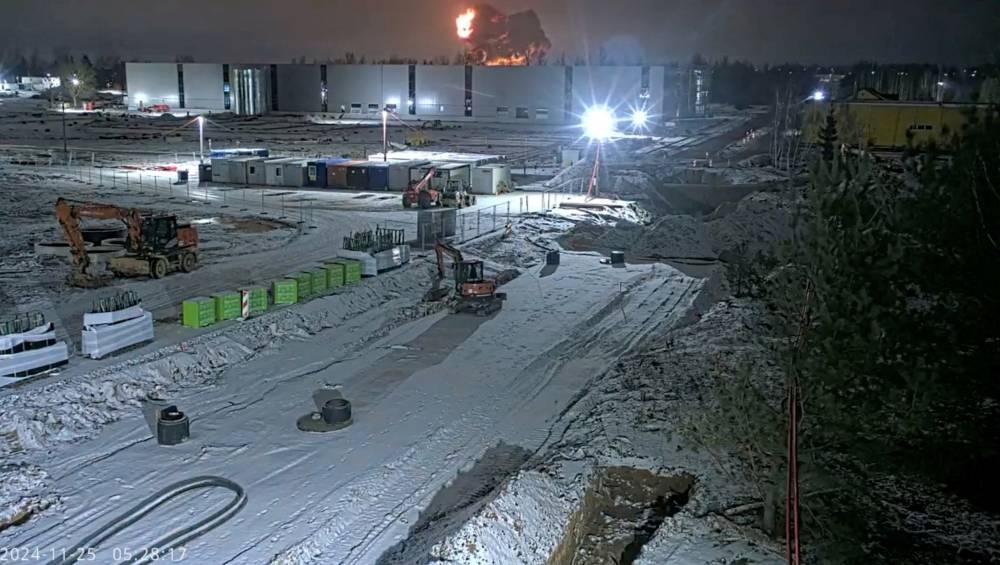 CCTV footage shows fire and smoke rising after a DHL cargo plane crashes in Vilnius, Lithuania, on Monday, Teltonika security camera/Handout via REUTERS