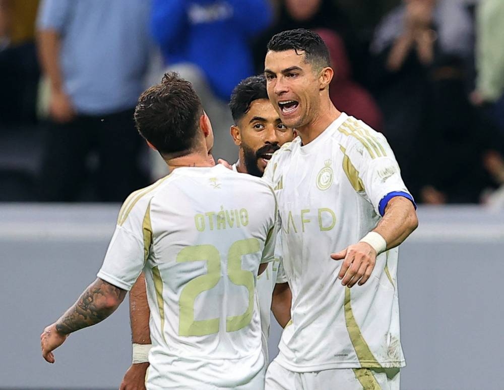 Al Nassr's Cristiano Ronaldo celebrates after scoring against Al Gharafa at the Al Bayt Stadium in Al Khor.  REUTERS