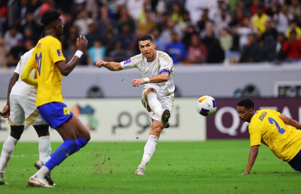 Al Nassr's Cristiano Ronaldo scores their third goal. REUTERS