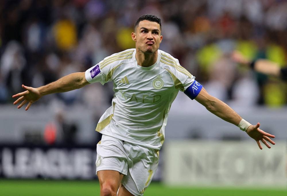 Al Nassr's Cristiano Ronaldo celebrates after scoring against Al Gharafa at the Al Bayt Stadium in Al Khor.  REUTERS