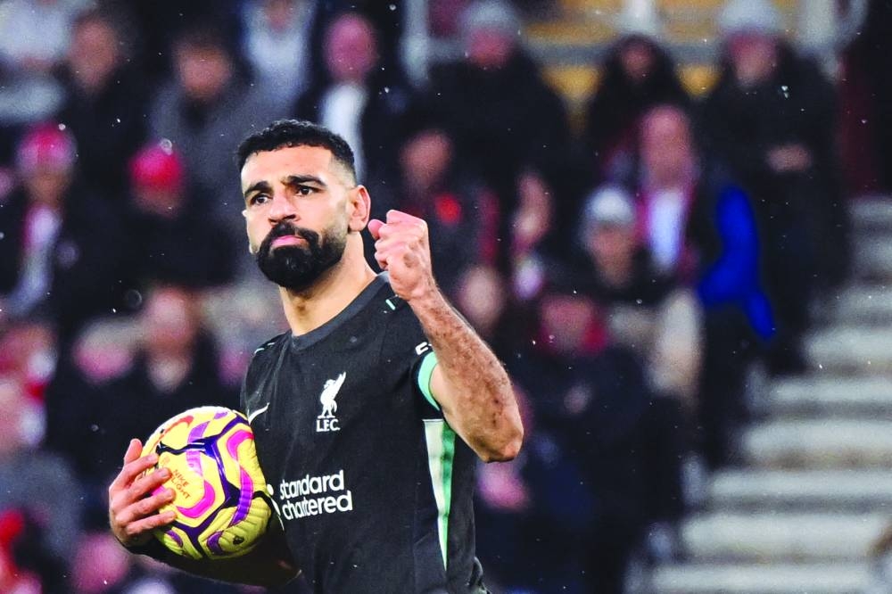 
Liverpool’s Mohamed Salah celebrates after scoring his team’s second goal during the English Premier League match against Southampton at St Mary’s Stadium in Southampton. (AFP)  