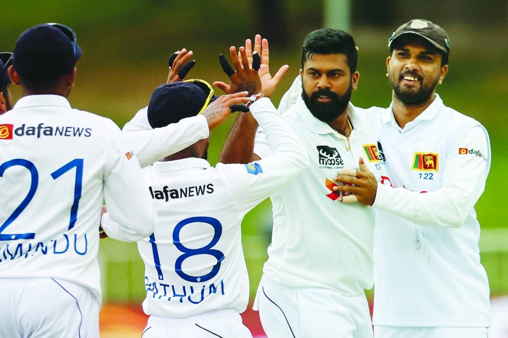 Sri Lanka’s Lahiru Kumara (second right) celebrates with teammates after the dismissal of South Africa’s David Bedingham (not in the picture) during the first day of the first Test at the Kingsmead Stadium in Durban on Wednesday. (AFP)