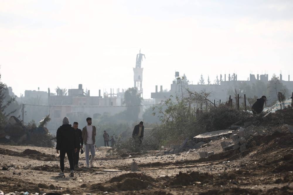 Palestinians return to Nuseirat in the central Gaza Strip after Israeli shelling of the camp stopped, on Friday. AFP
