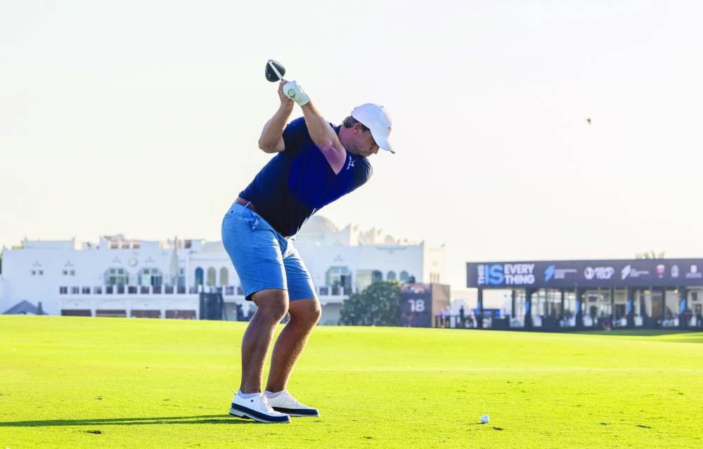 USA’s Peter Uihlein tees off during the round three of the International Series Qatar at the Doha Golf Club on Friday. Right: USA’s Zach Bauchou playing an approach shot on Friday.  PICTURES: Asian Tour
