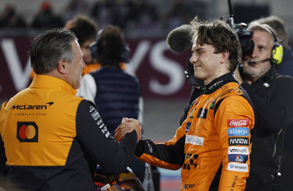 McLaren's Oscar Piastri celebrates winning the sprint race. REUTERS