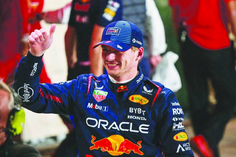 Red Bull Racing's Dutch driver Max Verstappen reacts after taking pole position at the end of the qualifying session of the Qatari Formula One Grand Prix at the Lusail International Circuit in Lusail, north of Doha, on November 30, 2024. (Photo by Giuseppe CACACE / AFP)