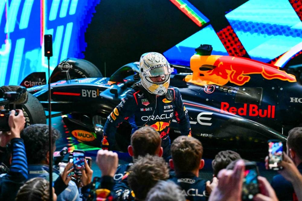 Red Bull Racing's Dutch driver Max Verstappen celebrates after winning the Qatari Formula One Grand Prix. AFP