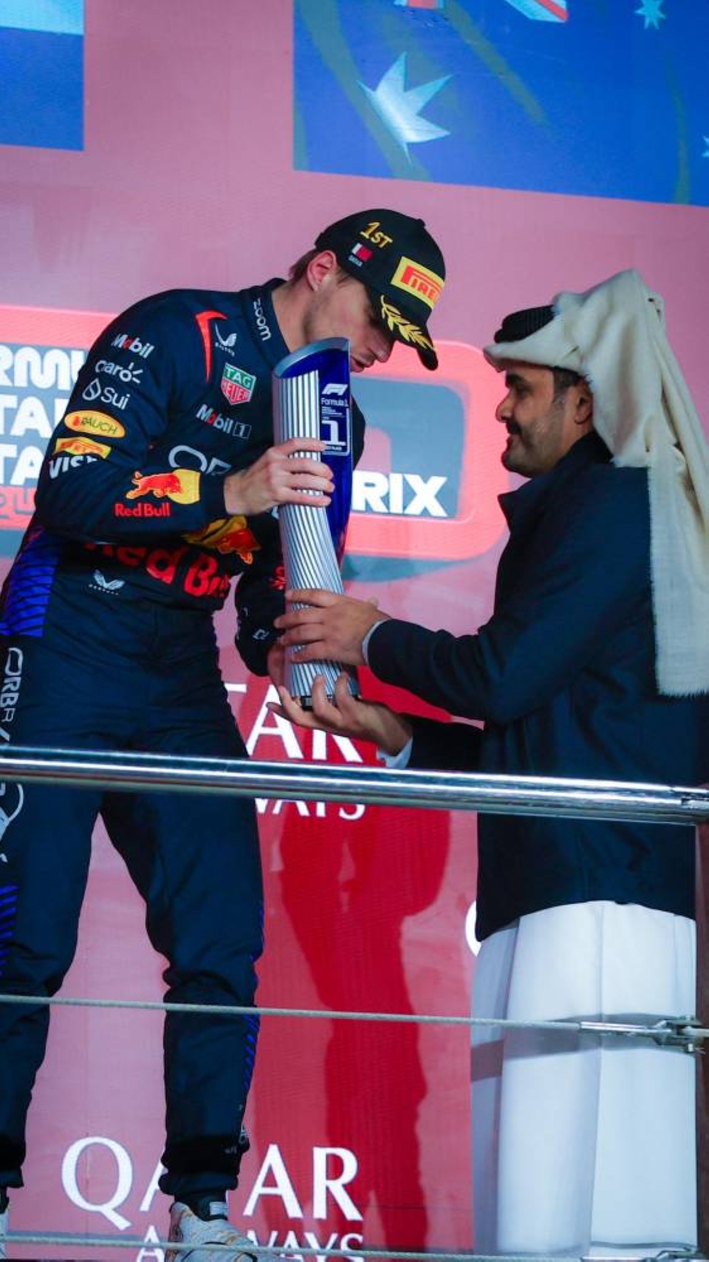 Red Bull Racing’s driver Max Verstappen receives the trophy from Qatar Olympic Committee President HE Sheikh Joaan bin Hamad al-Thani after winning the Formula 1 Qatar Grand Prix at the Lusial International Circuit in Doha Sunday.