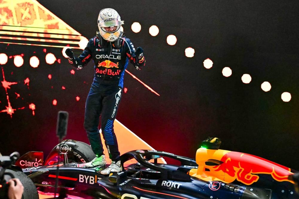 Red Bull Racing's Dutch driver Max Verstappen celebrates after winning the Qatari Formula One Grand Prix at the Lusail International Circuit in Lusail, north of Doha, on Sunday. AFP