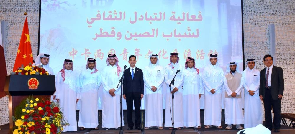Ambassador Cao Xiaolin and Dr Jian Zhao with a group of Qatari students at the event. PICTURES: Thajudheen